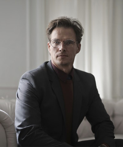 Well Dressed Businessman Sitting On Sofa 1